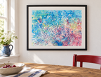 Illustrative room mockup of Explosions of Colour by Iris Grace in a black frame