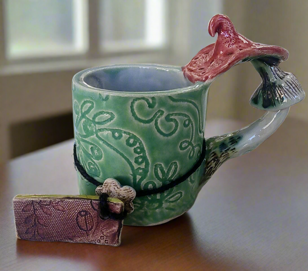 Marika Du Plessis- Toadstool Coffee Cup, Green - Primrose Gallery and Framing 