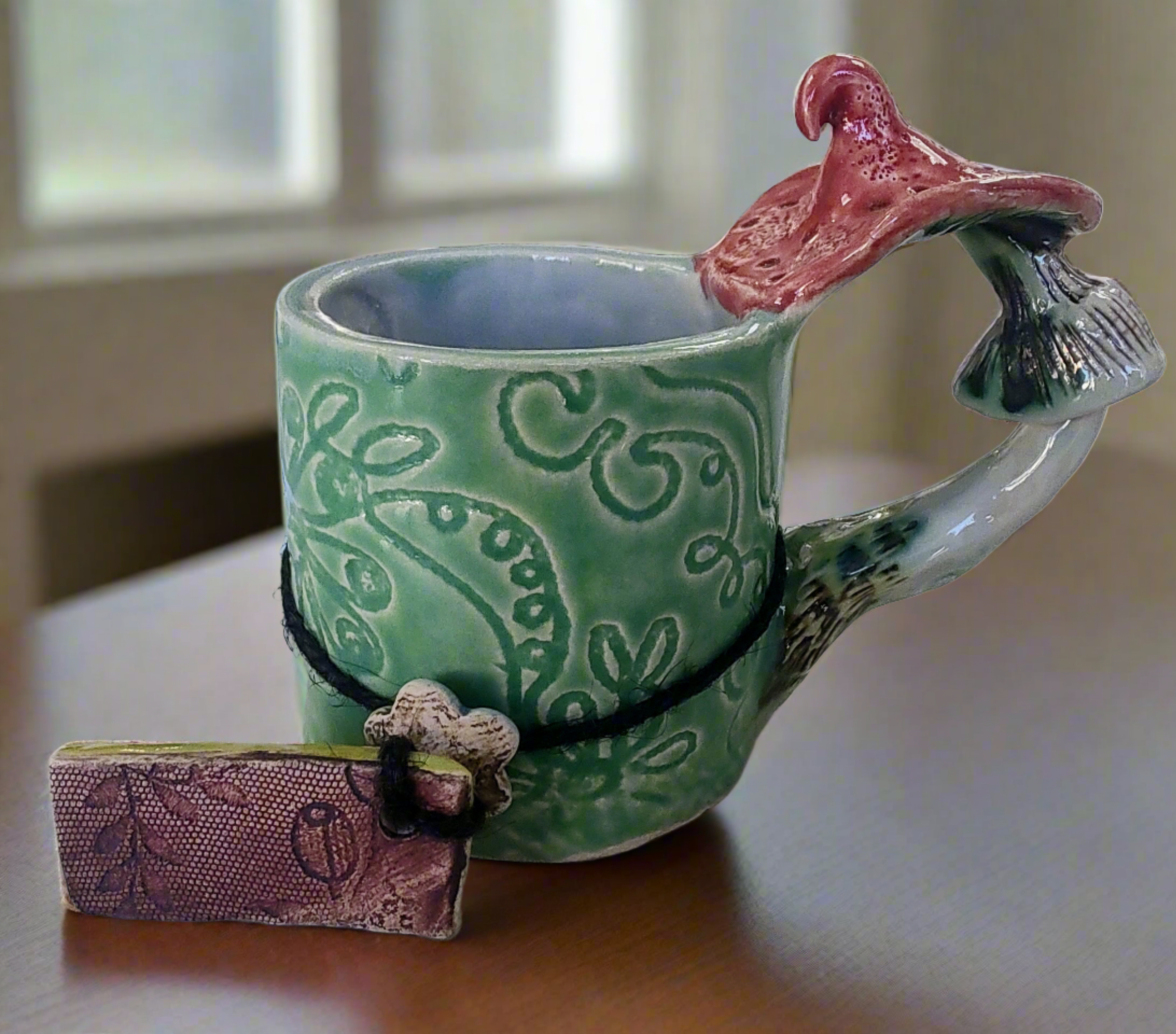 Marika Du Plessis- Toadstool Coffee Cup, Green - Primrose Gallery and Framing 