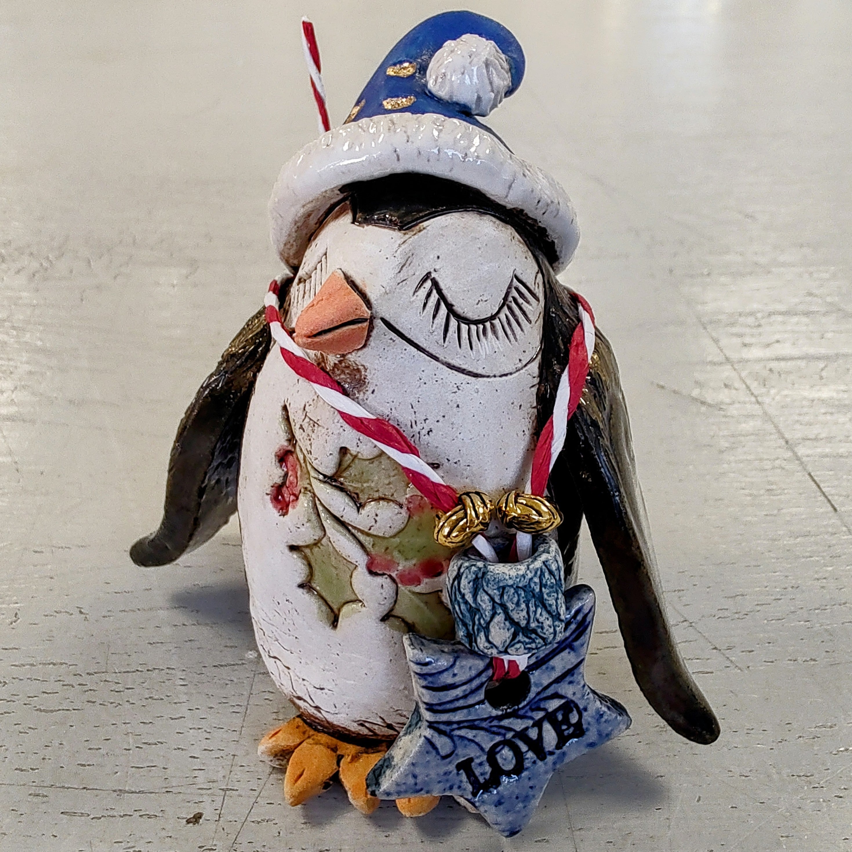 Marika Du Plessis- Quirky Penguin, Ceramic Christmas Decoration, Blue Hat - Primrose Gallery and Framing 
