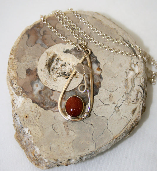 Helen West- Silver and goldstone pendant on silver chain - Primrose Gallery