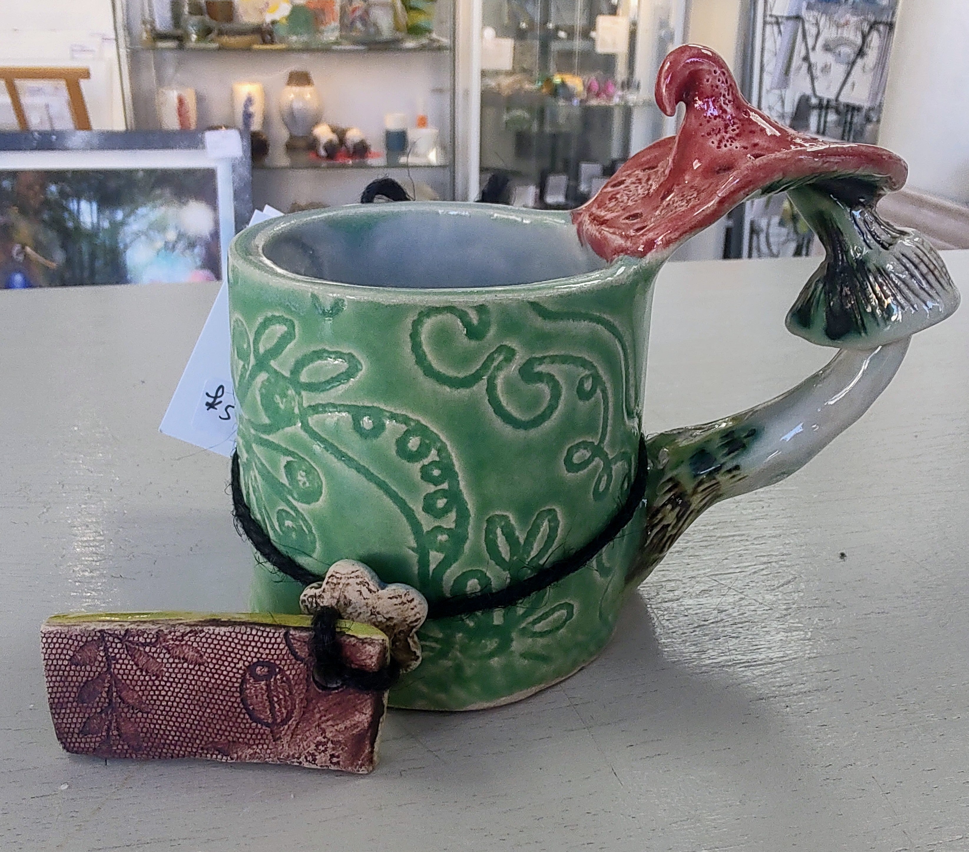 Marika Du Plessis- Toadstool Coffee Cup, Green - Primrose Gallery and Framing 