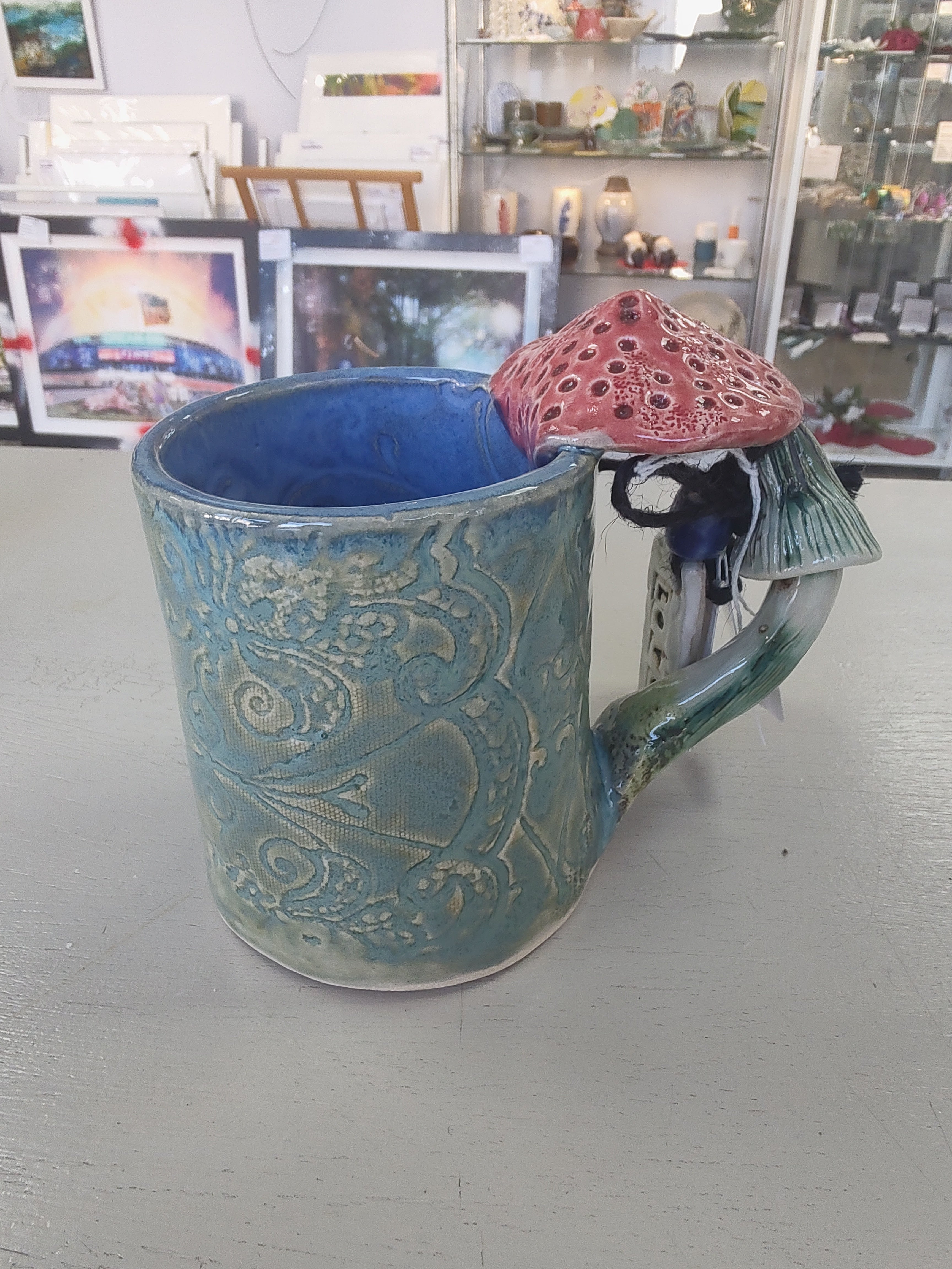 Marika Du Plessis- Toadstool Coffee Mug, Green - Primrose Gallery and Framing 